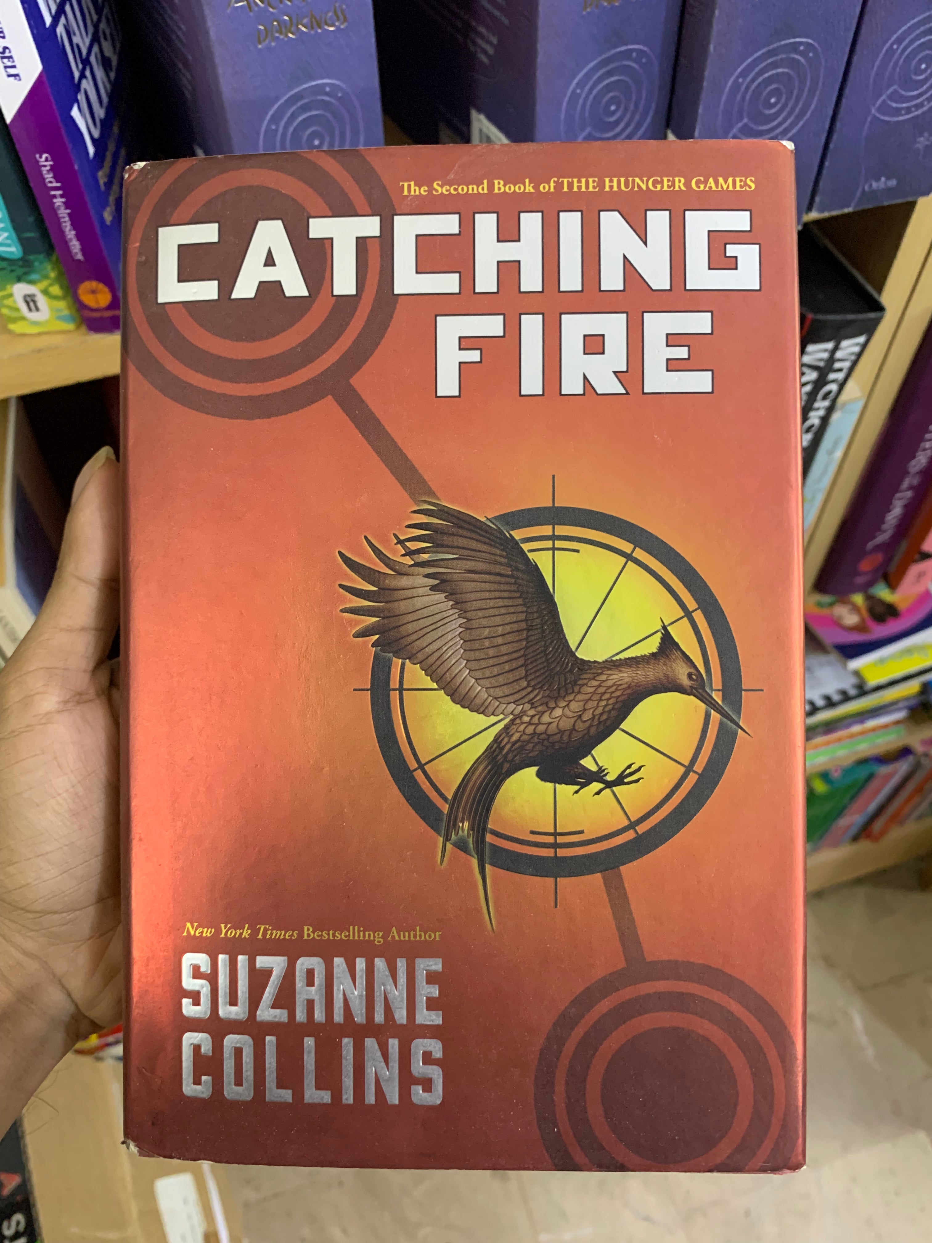 Catching Fire (Hunger Games Trilogy Book 2) (Original Hardcover Edition) Booklify